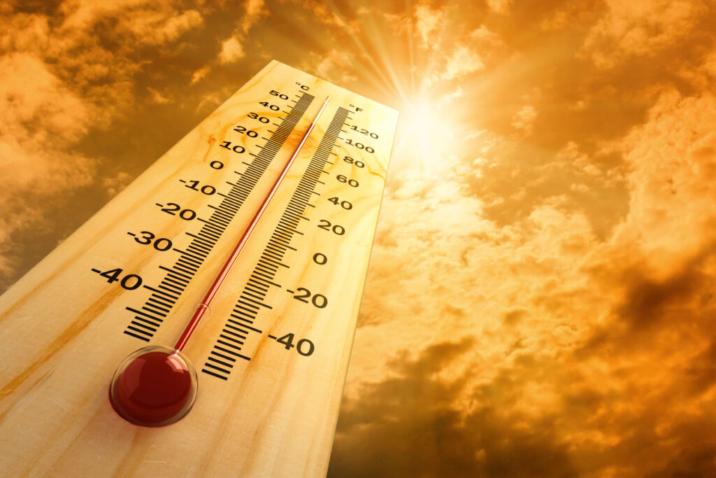thermometer showing hot temperatures under a bright sun